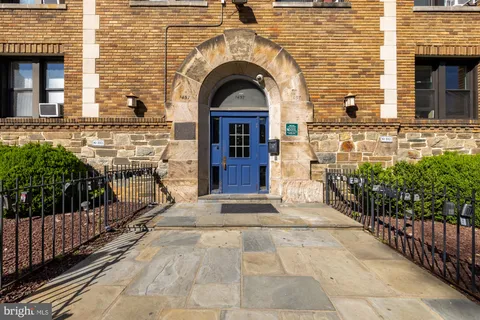 a view of entrance of the house with a balcony