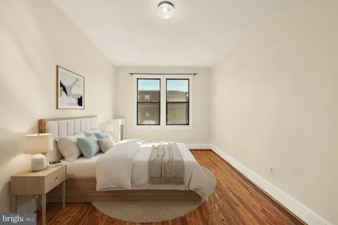 a room with bed and window