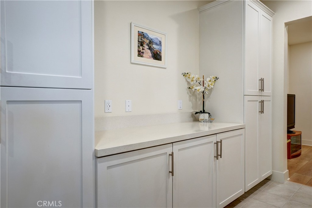 16235 Dawn Way, Unit 203 Tustin, CA 92782 - Photo 13 of 74 a bathroom with a sink and mirror