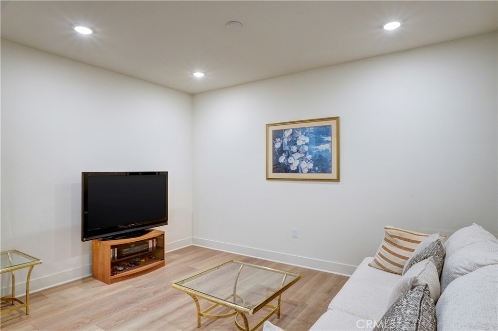 16235 Dawn Way, Unit 203 Tustin, CA 92782 - Photo 22 of 74 a living room with furniture and a flat screen tv