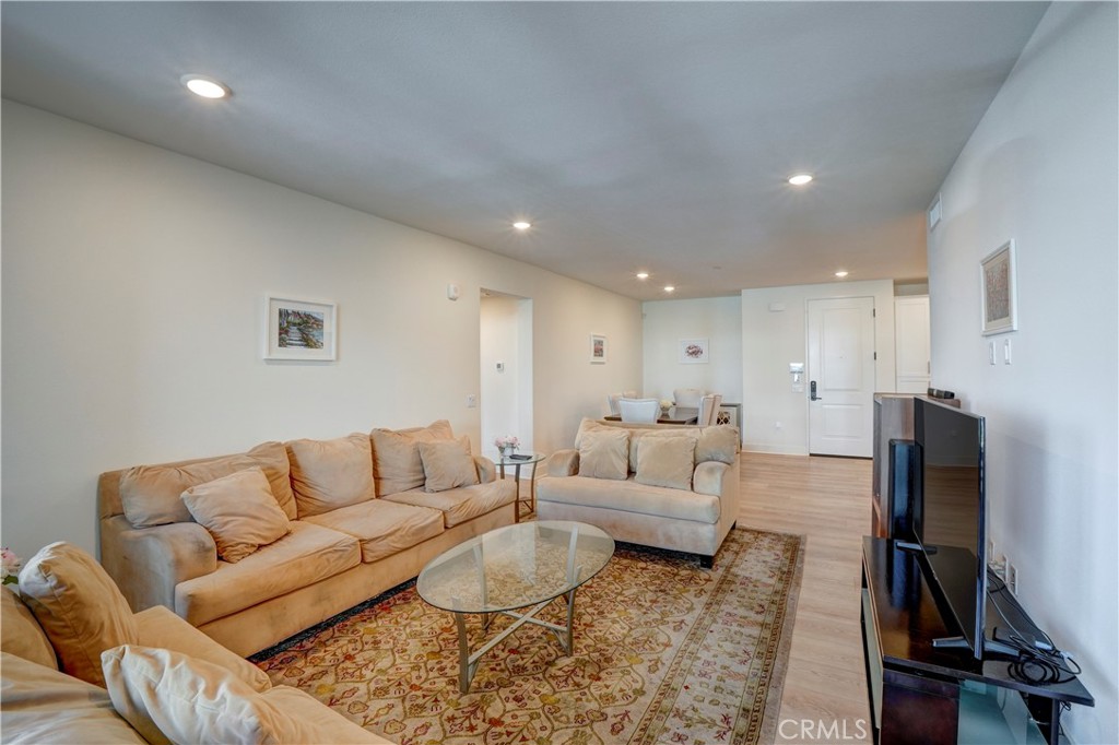 16235 Dawn Way, Unit 203 Tustin, CA 92782 - Photo 26 of 74 a living room with furniture and a flat screen tv