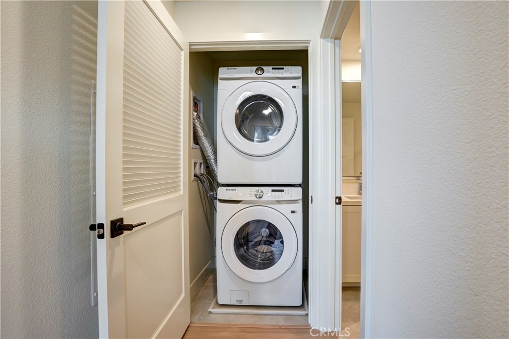 16235 Dawn Way, Unit 203 Tustin, CA 92782 - Photo 31 of 74 a view of washer and dryer in a utility room