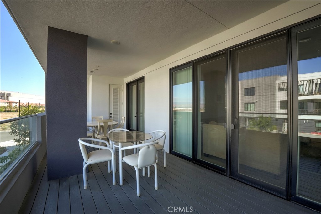 16235 Dawn Way, Unit 203 Tustin, CA 92782 - Photo 5 of 74 a view of a dining room with furniture and wooden floor