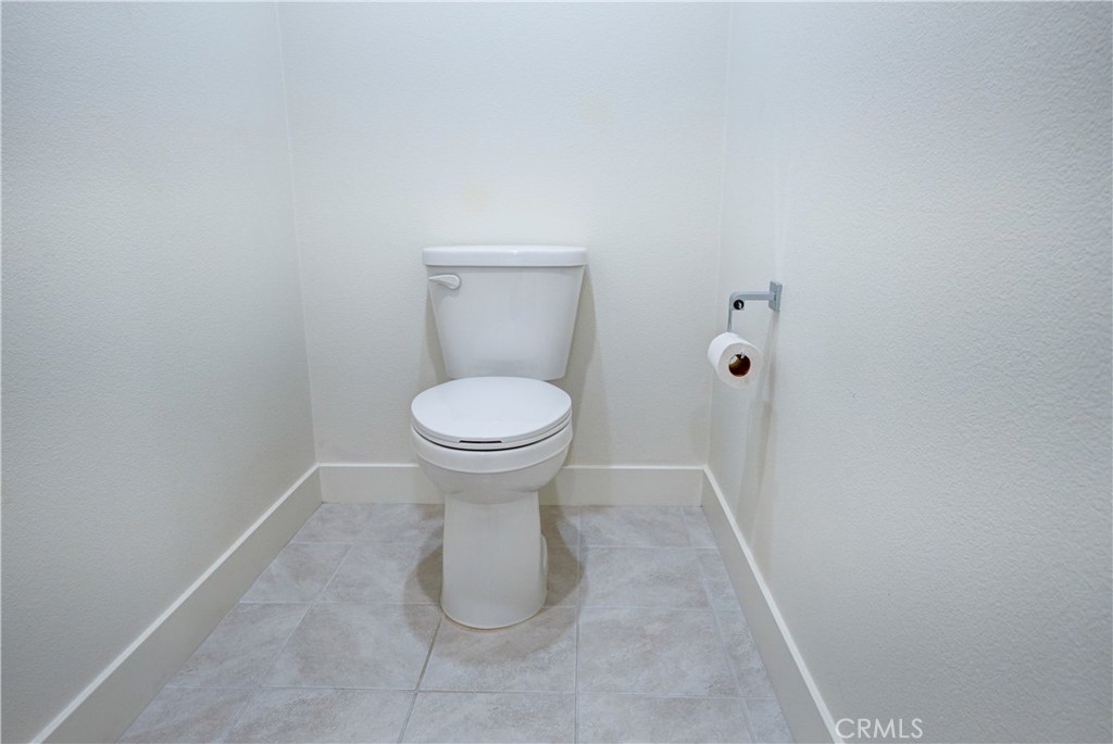 16235 Dawn Way, Unit 203 Tustin, CA 92782 - Photo 54 of 74 a bathroom with a toilet and a shower
