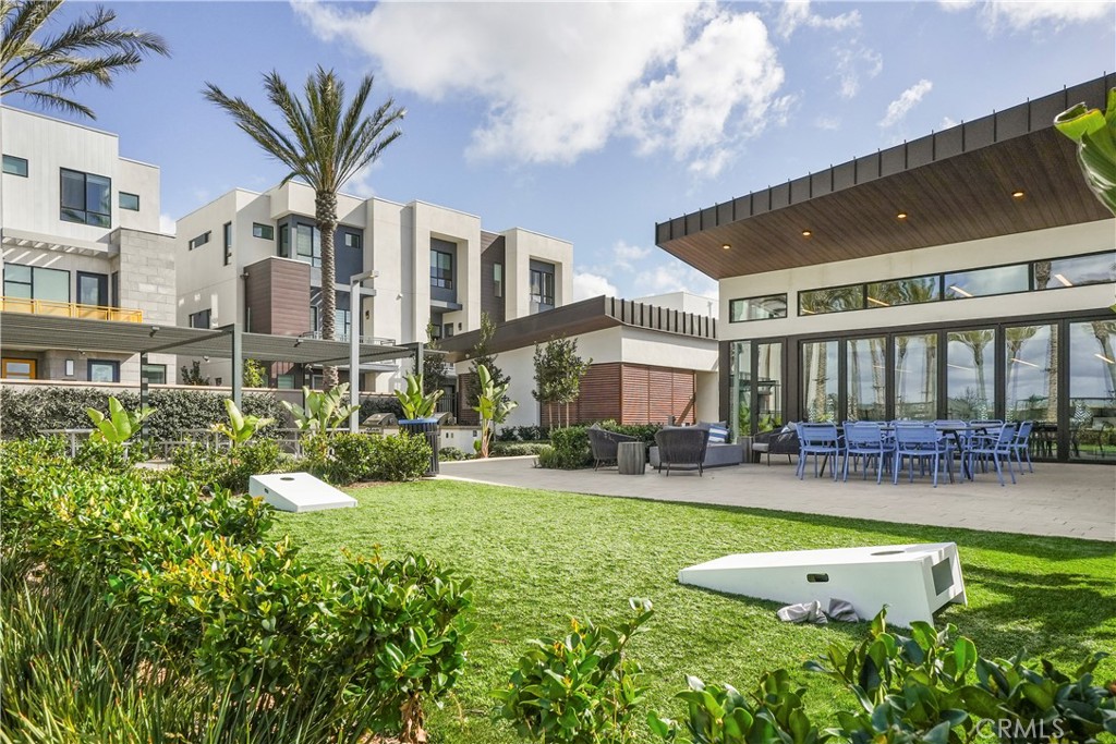 16235 Dawn Way, Unit 203 Tustin, CA 92782 - Photo 65 of 74 a view of a house with swimming pool and sitting area
