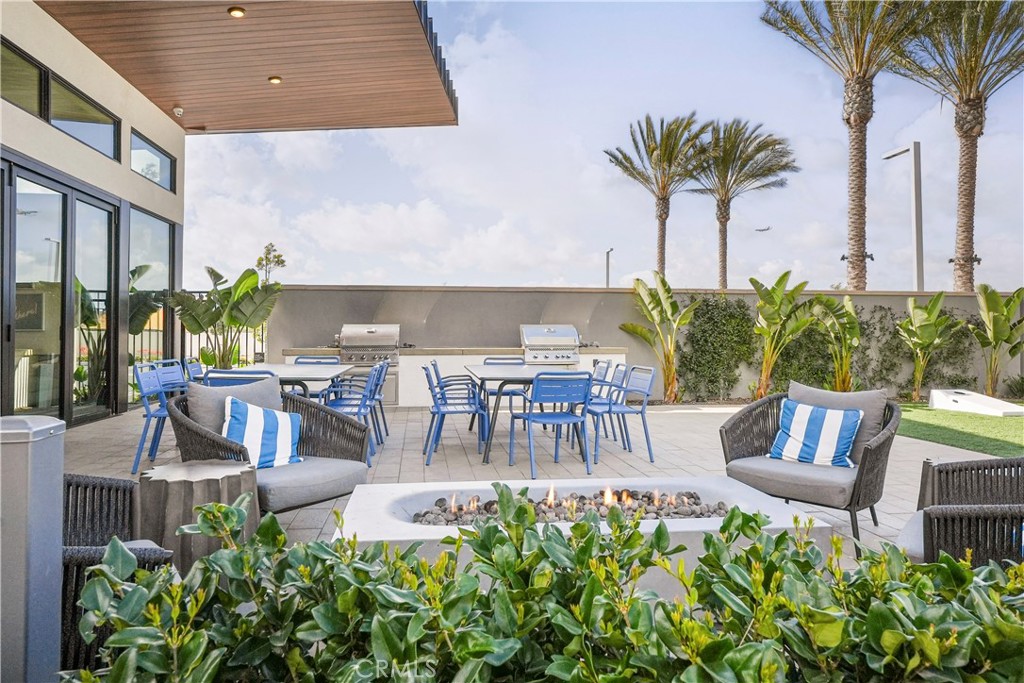 16235 Dawn Way, Unit 203 Tustin, CA 92782 - Photo 68 of 74 a view of an chairs and tables in the patio