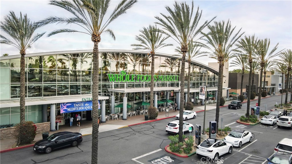 16235 Dawn Way, Unit 203 Tustin, CA 92782 - Photo 74 of 74 a view of a chair and tables in the patio in front of a house
