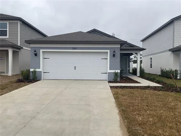 a view of garage and yard