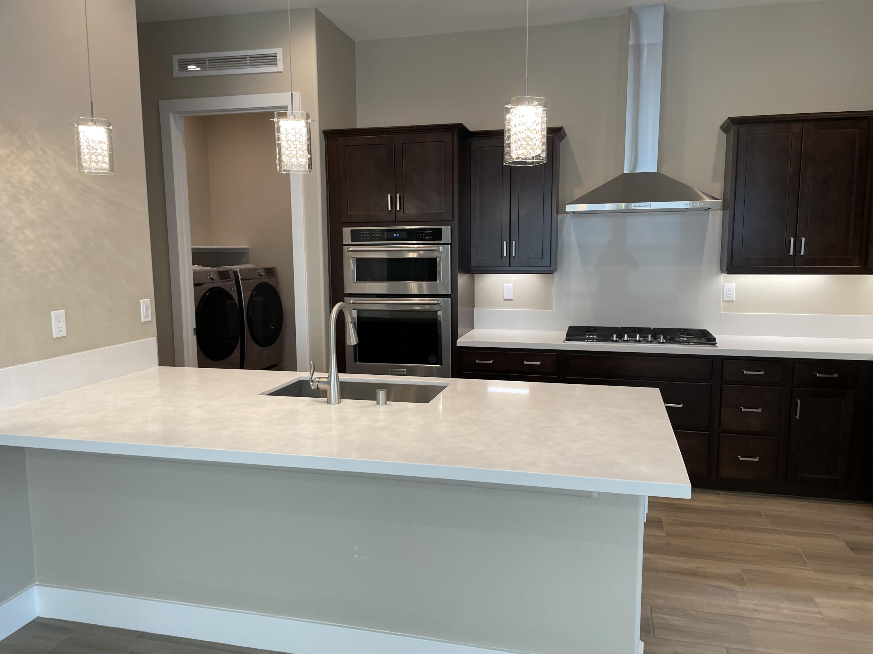 35 Semillon Rancho Mirage, CA 92270 - Photo 3 of 13 a kitchen with a refrigerator and a stove