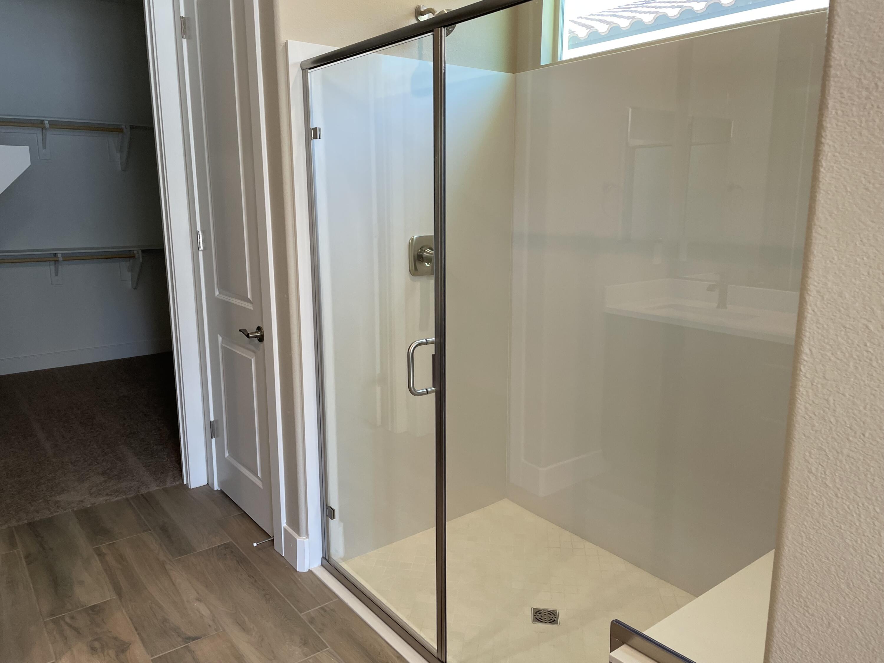 35 Semillon Rancho Mirage, CA 92270 - Photo 8 of 13 a bathroom with a glass shower door