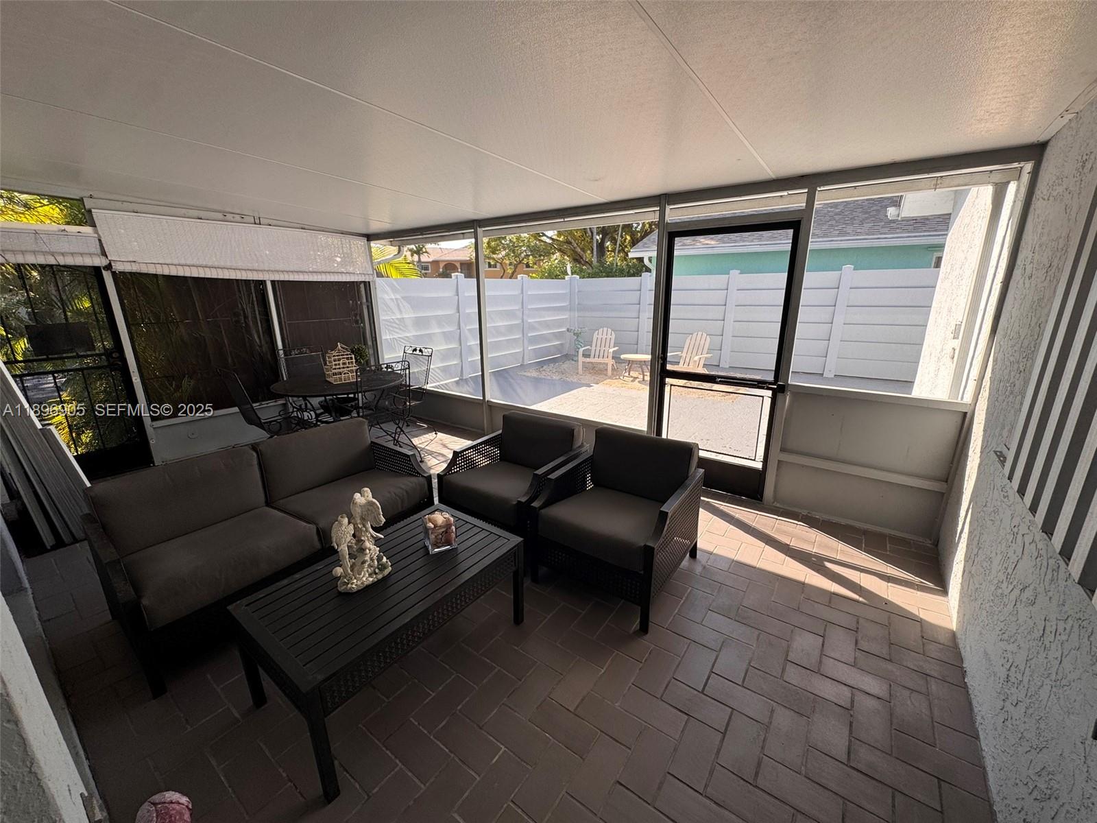 705 Southeast 3rd Lane Dania Beach, FL 33004 - Photo 13 of 15 a living room with furniture and a flat screen tv