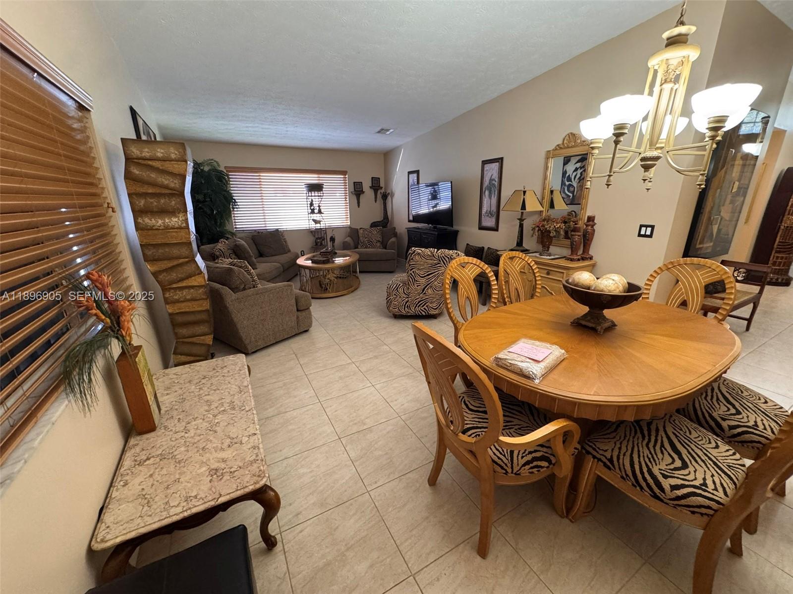 705 Southeast 3rd Lane Dania Beach, FL 33004 - Photo 7 of 15 a view of a dining room with furniture
