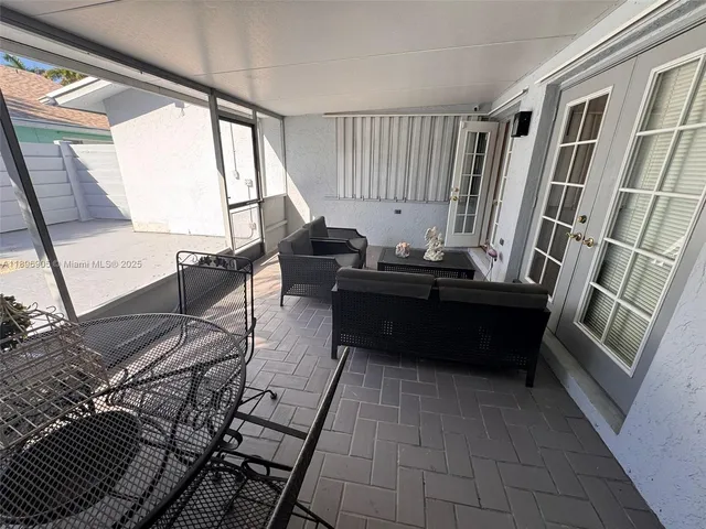 a room with wooden floor and furniture