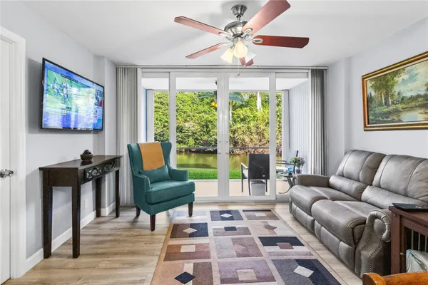 a living room with furniture and a large window
