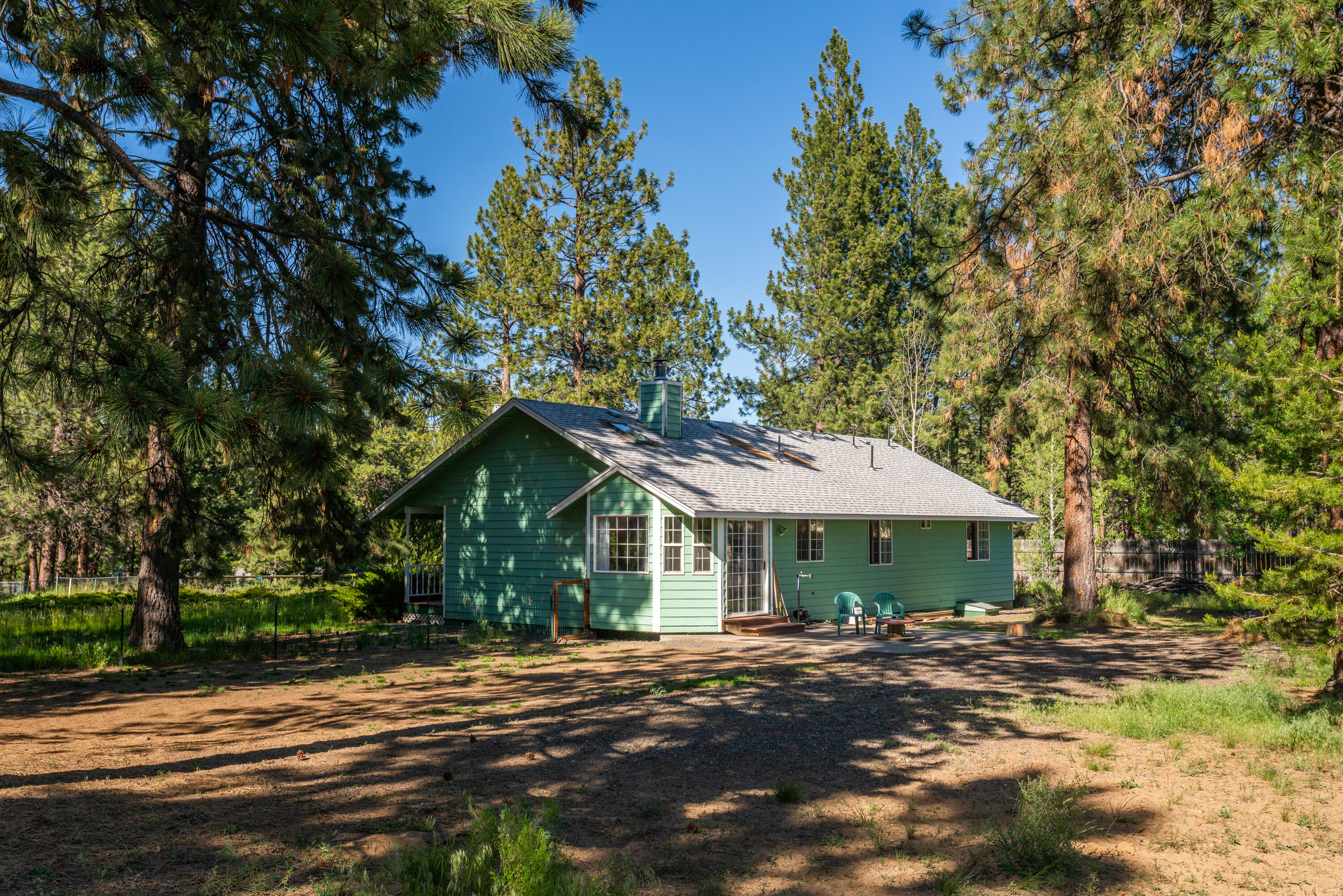 19335 Mohawk Road Bend, OR 97702 - Photo 16 of 24 a front view of a house with a garden