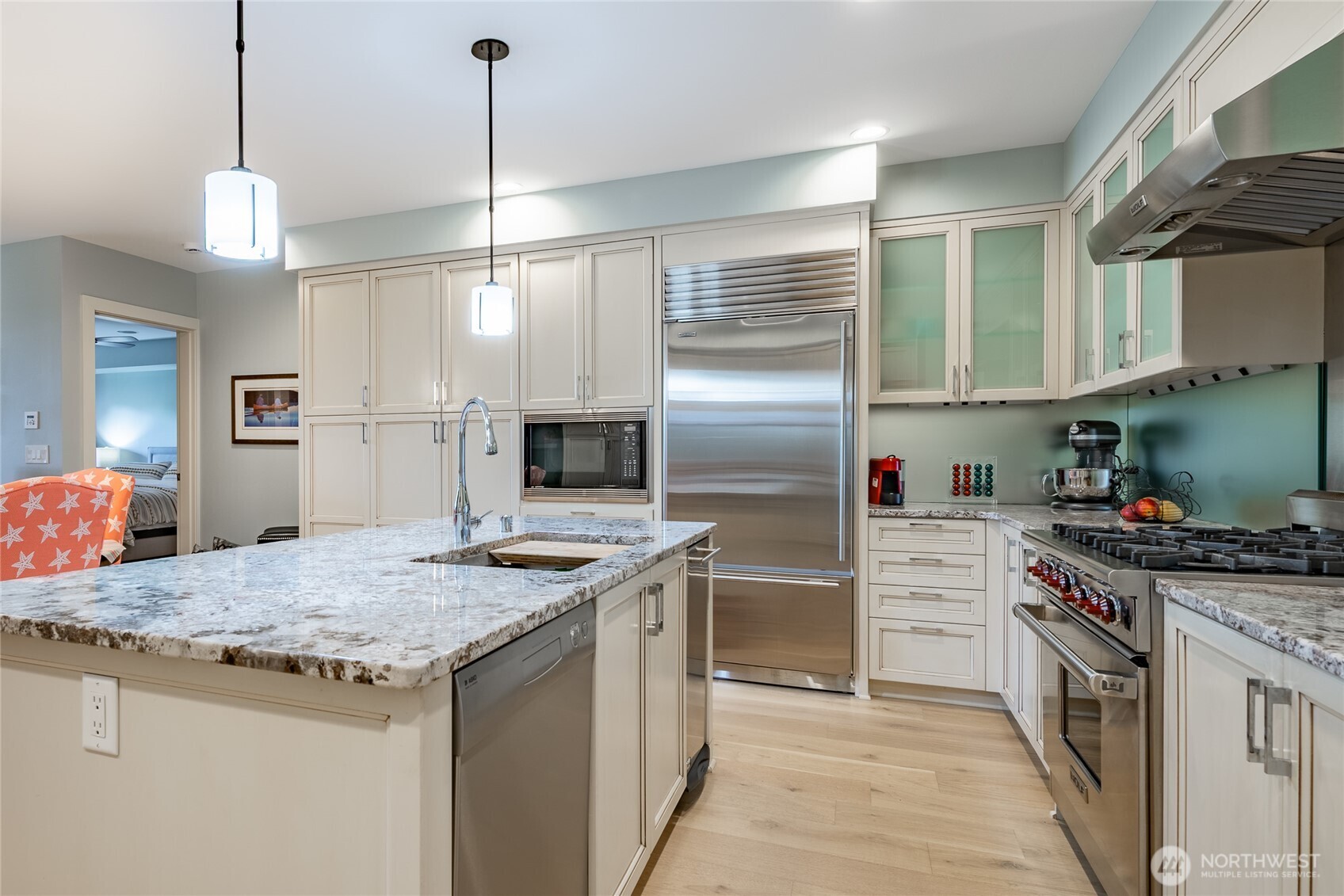 9525 Semiahmoo Parkway, Unit A204 Blaine, WA 98230 - Photo 13 of 37 a kitchen with stainless steel appliances granite countertop a sink stove and refrigerator