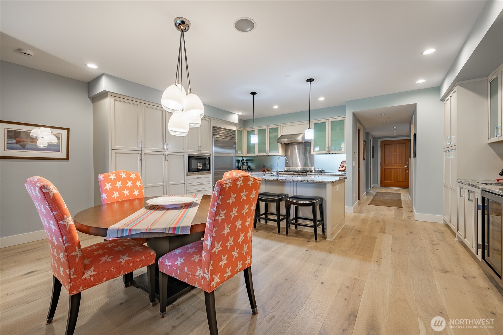 9525 Semiahmoo Parkway, Unit A204 Blaine, WA 98230 - Photo 18 of 37 a dining room filled chandelier and wooden furniture