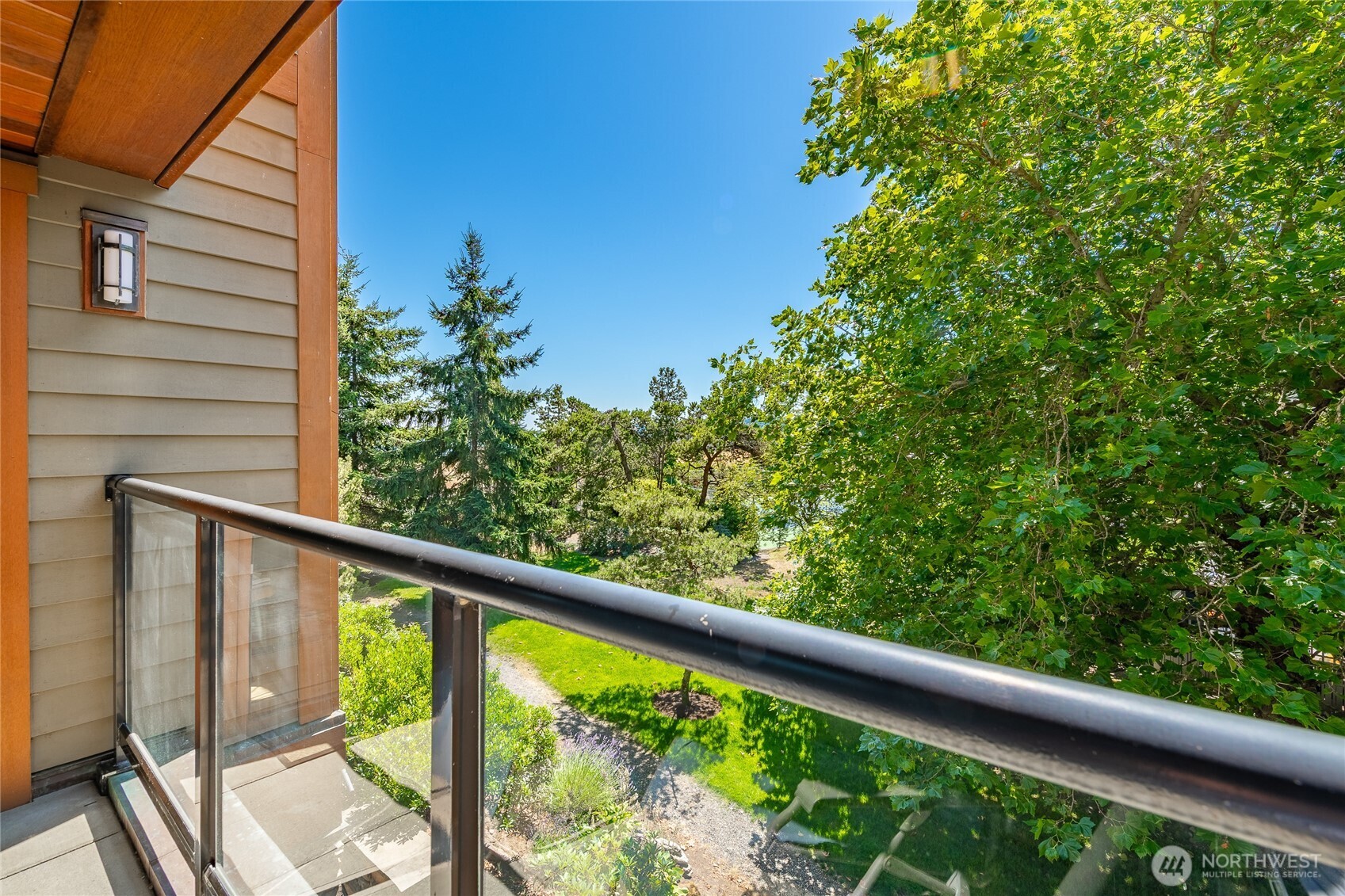 9525 Semiahmoo Parkway, Unit A204 Blaine, WA 98230 - Photo 22 of 37 a view of a balcony with a tree
