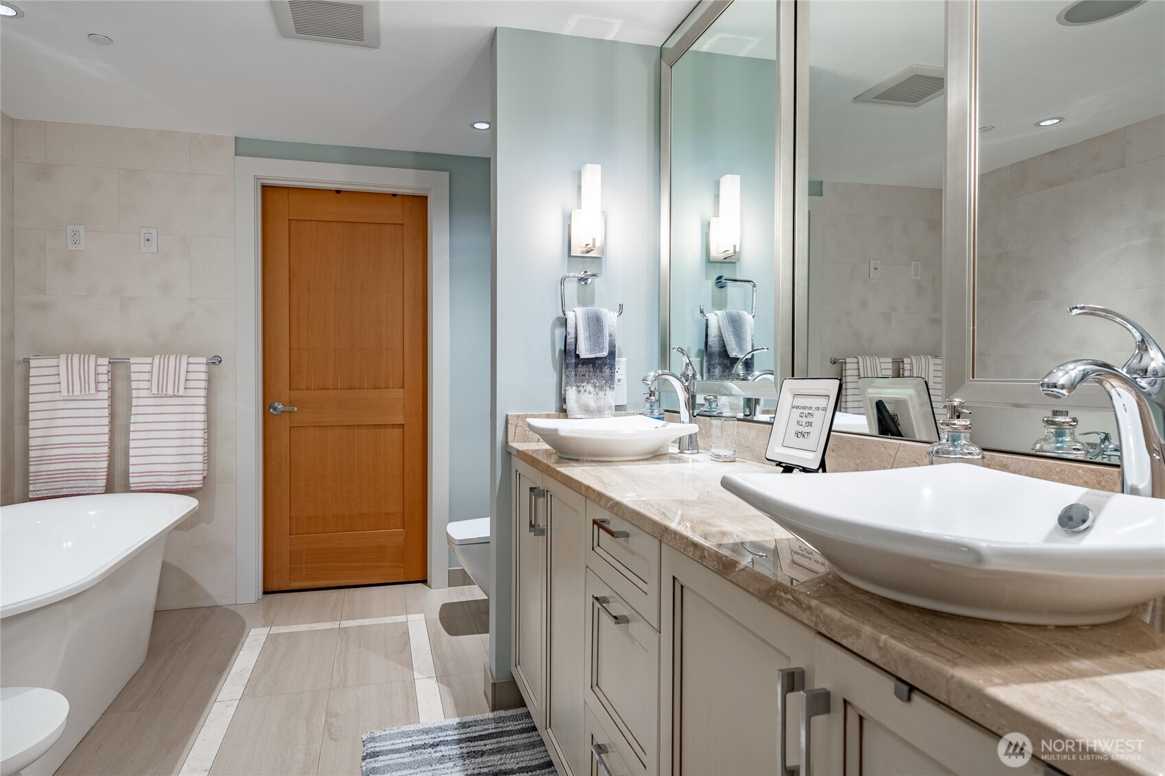 9525 Semiahmoo Parkway, Unit A204 Blaine, WA 98230 - Photo 25 of 37 a bathroom with a granite countertop sink and a mirror