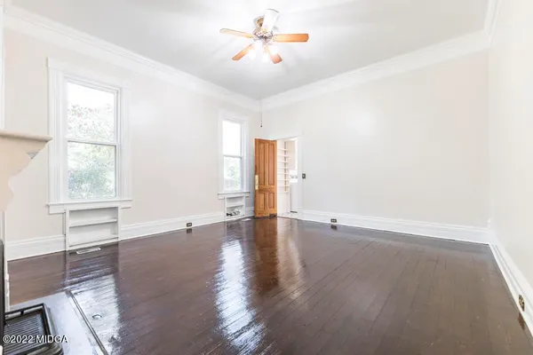 a view of an entryway with wooden floor
