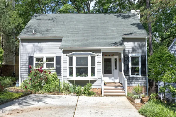 front view of a house with a garden