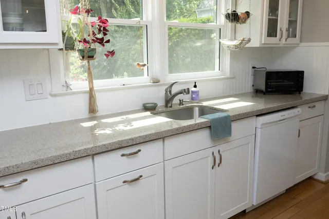 a kitchen with a sink and cabinets