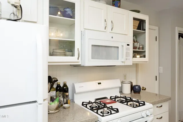 a kitchen with a stove and cabinets
