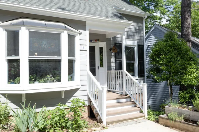 a view of a house with a window and stairs
