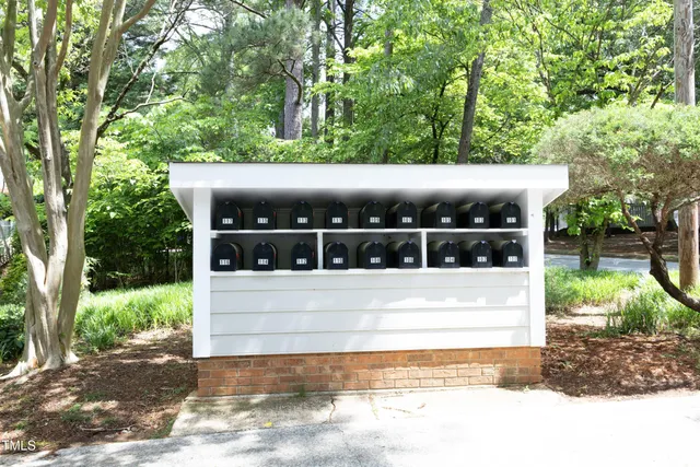 a view of house with a yard