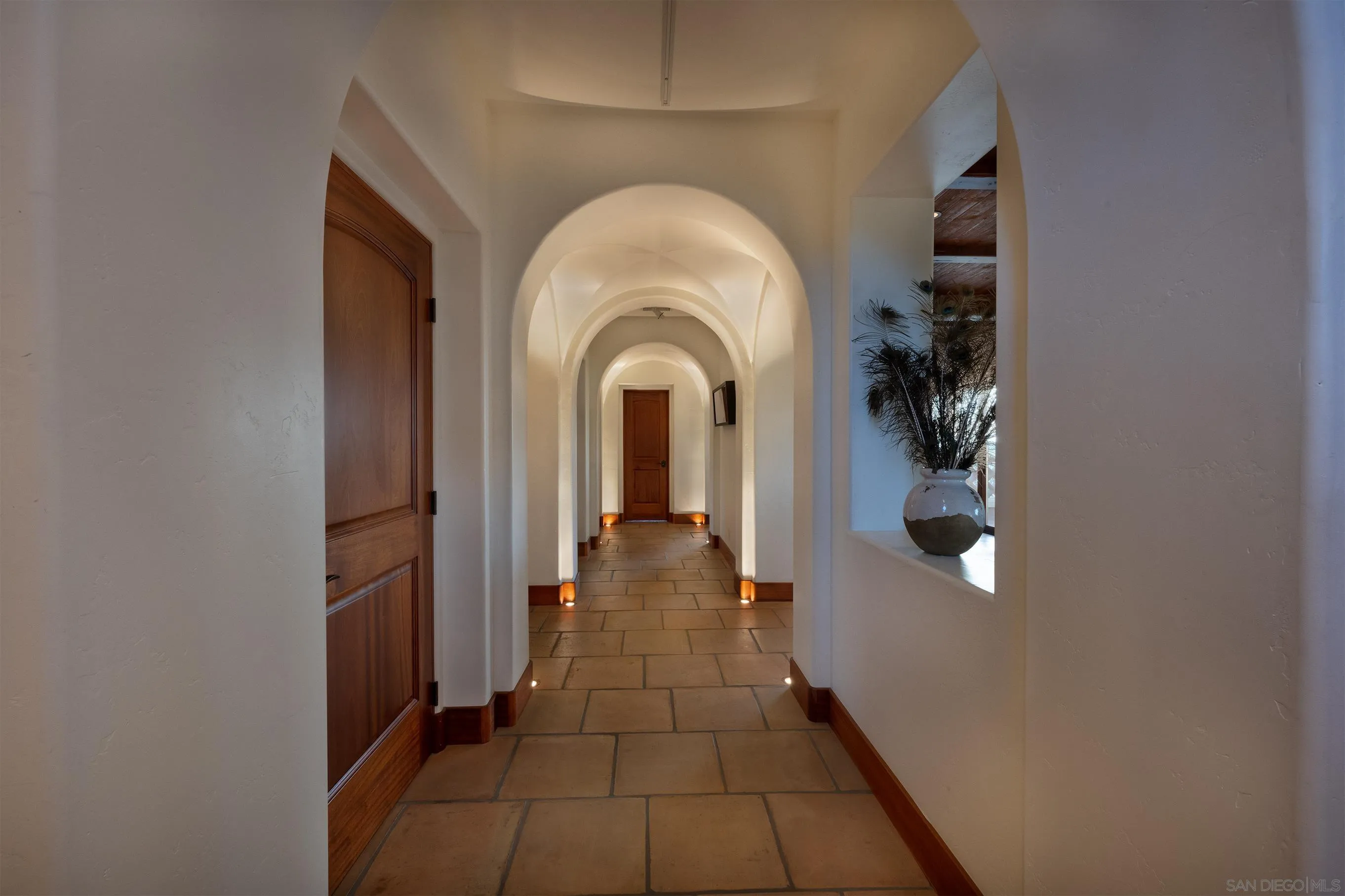 1245 Park Row La Jolla, CA 92037 - Photo 7 of 23 a view of a hallway with entryway wooden floor and a bathroom
