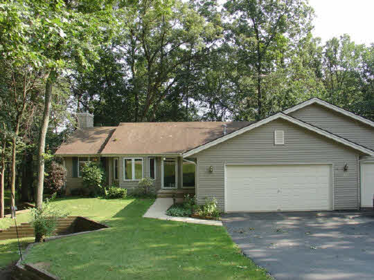 229 Rochester Road Northeast Poplar Grove, IL 61065 - Photo 1 of 6 a front view of a house with garden