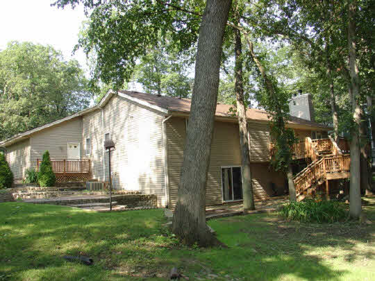 229 Rochester Road Northeast Poplar Grove, IL 61065 - Photo 2 of 6 a view of backyard with a garden and plants