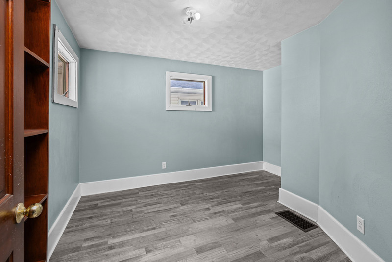 1419 17th Street Moline, IL 61265 - Photo 15 of 28 a view of an empty room with wooden floor