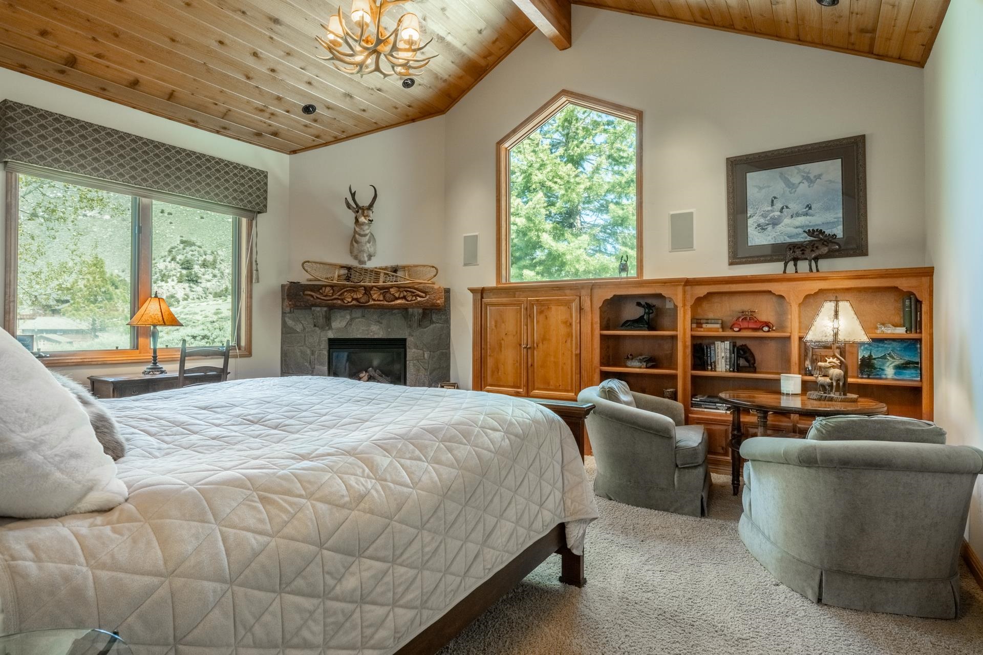 45 Skyline Road June Lake, CA 93529 - Photo 31 of 58 a bed room with a bed and a fireplace
