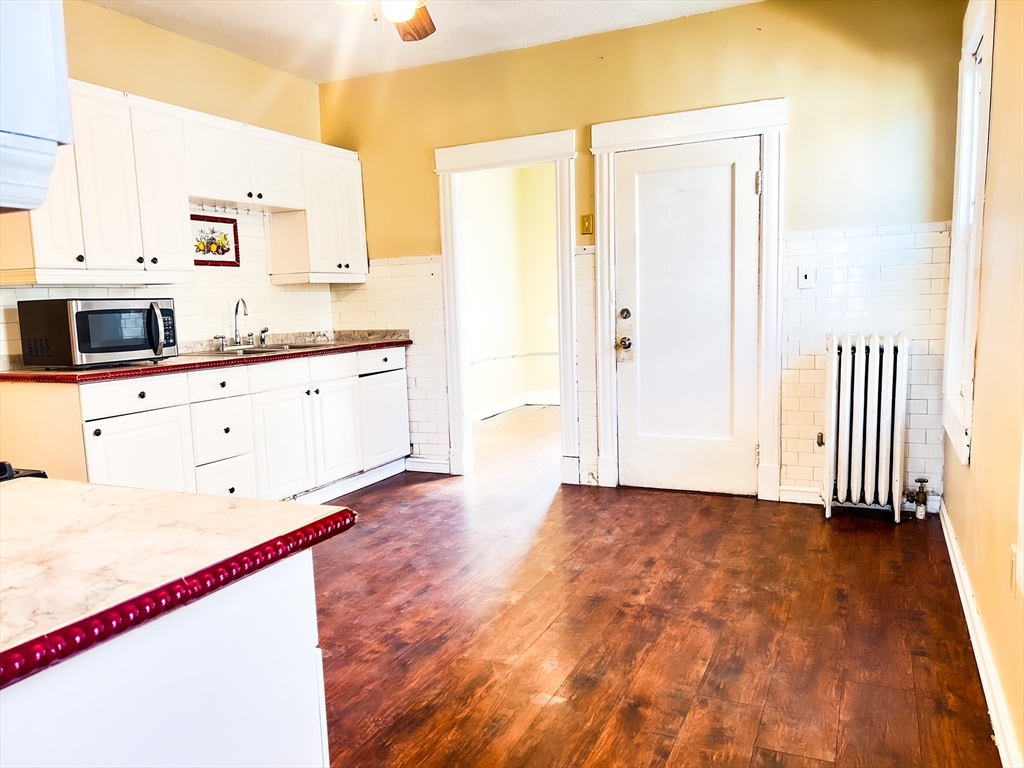 68 Forest Park Avenue Springfield, MA 01108 - Photo 14 of 19 a view of a kitchen with wooden floor