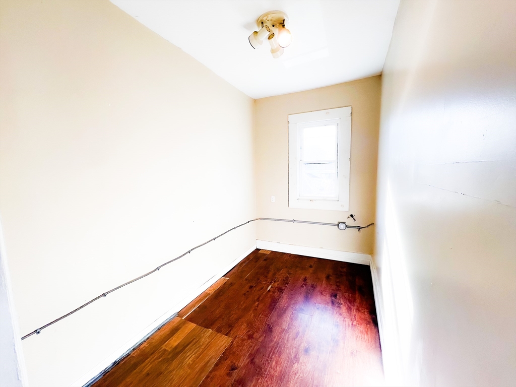 68 Forest Park Avenue Springfield, MA 01108 - Photo 16 of 19 a view of a room with wooden floor and a window