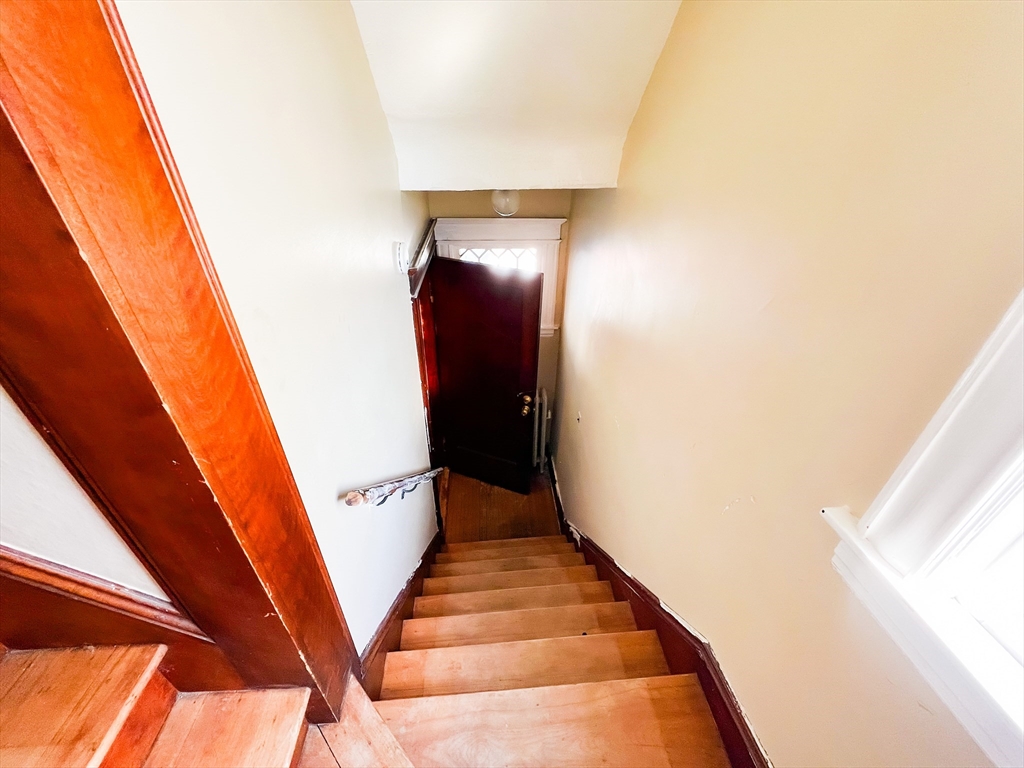 68 Forest Park Avenue Springfield, MA 01108 - Photo 2 of 19 a view of stairs and wooden floor