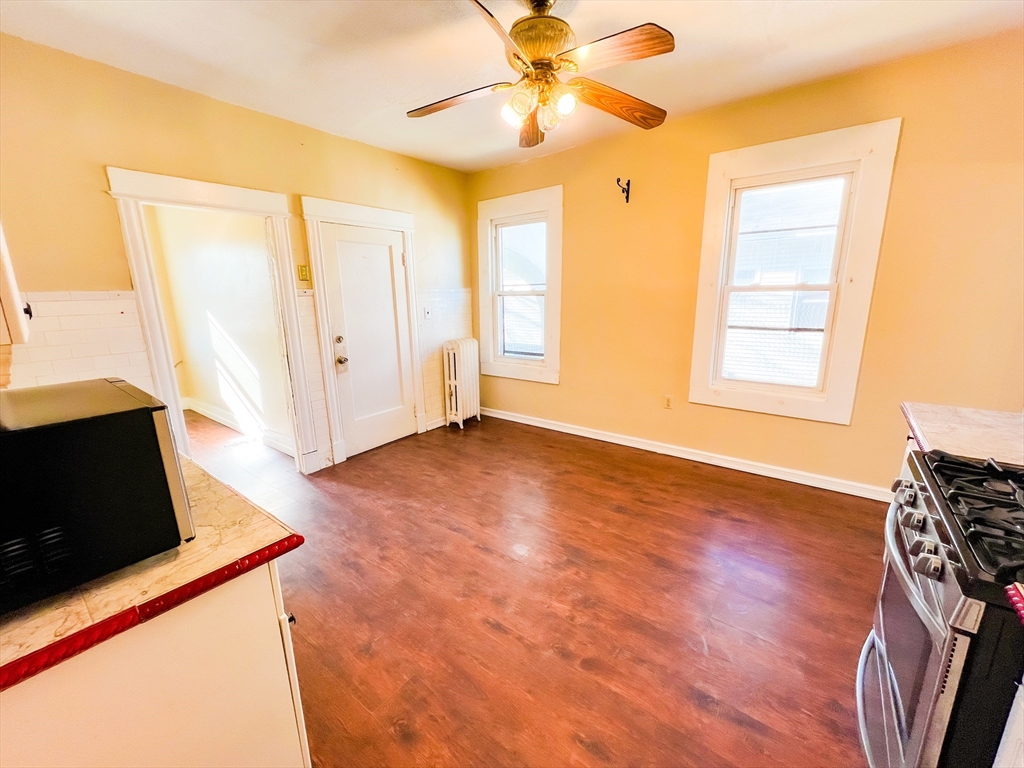 68 Forest Park Avenue Springfield, MA 01108 - Photo 7 of 19 a view of livingroom with hardwood floor and a ceiling fan