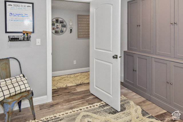 1500 Fish Creek Road Bancroft, ID 83217 - Photo 27 of 45 Living area featuring light wood-style flooring and baseboards