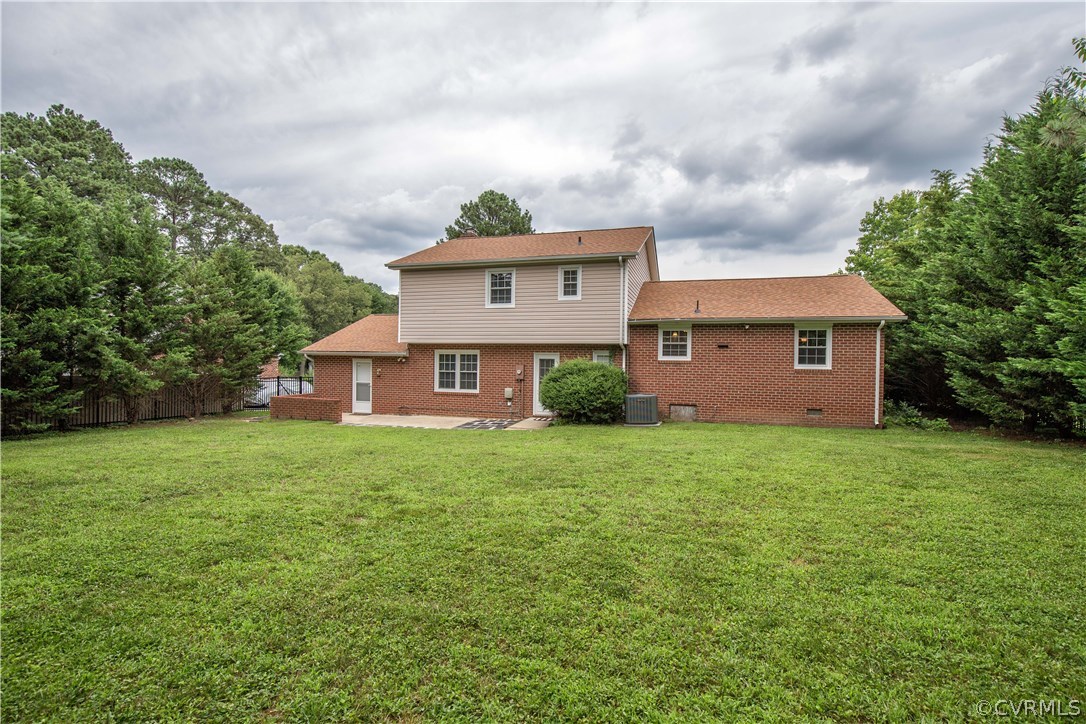 4511 Crossgate Road Chester, VA 23831 - Photo 20 of 21 The rear view of the home highlights the brick ext