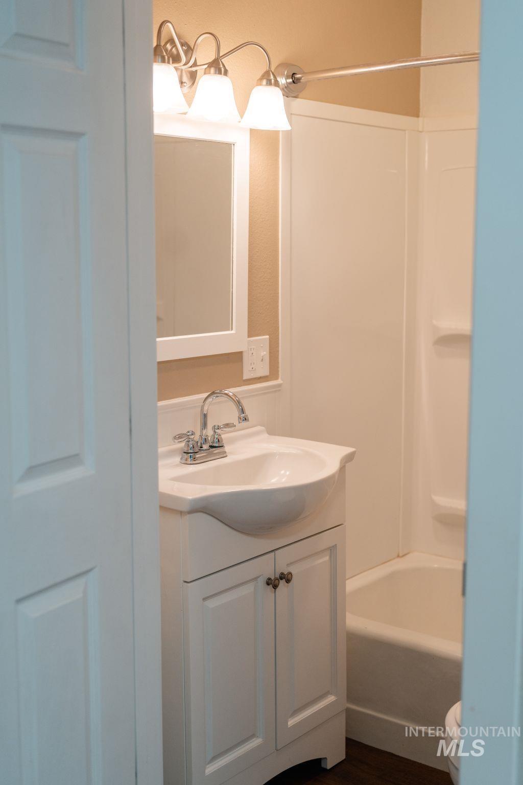 1269 Main Street Pomeroy, WA 99347 - Photo 19 of 38 Full bath featuring vanity, bathtub / shower combination, and dark wood-type flooring