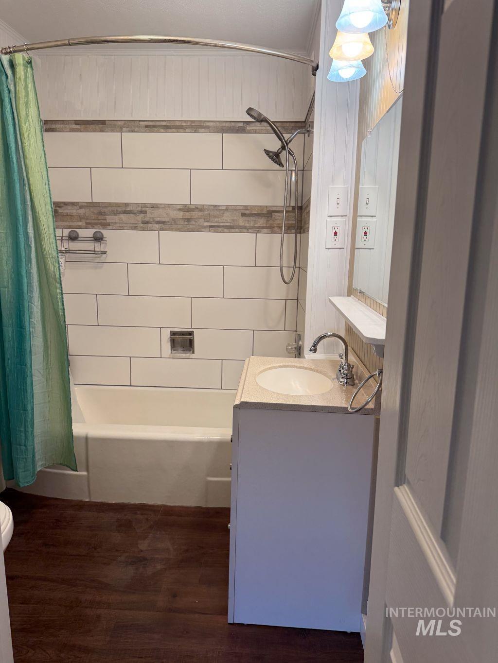 1269 Main Street Pomeroy, WA 99347 - Photo 22 of 38 Full bathroom featuring vanity, shower / bath combo with shower curtain, and dark wood-type flooring