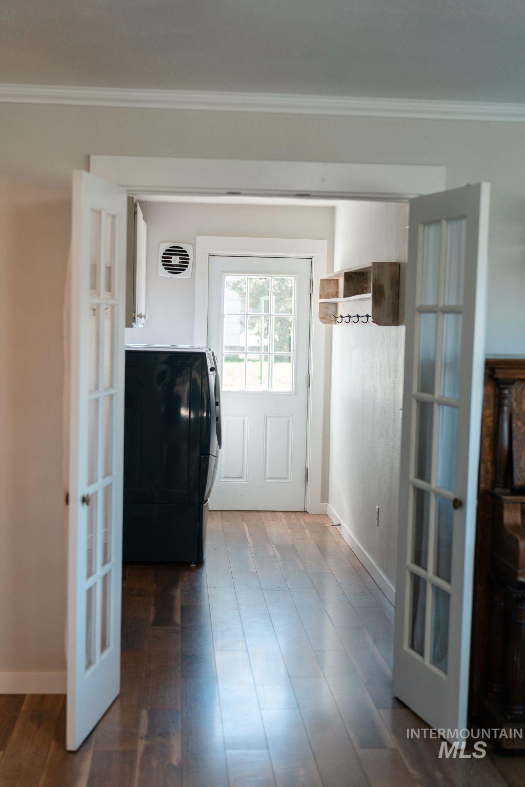 1269 Main Street Pomeroy, WA 99347 - Photo 27 of 38 Entryway featuring washer / clothes dryer, wood finished floors, and ornamental molding