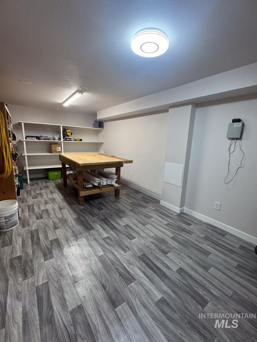 1269 Main Street Pomeroy, WA 99347 - Photo 33 of 38 Game room featuring dark wood-style flooring and a textured ceiling