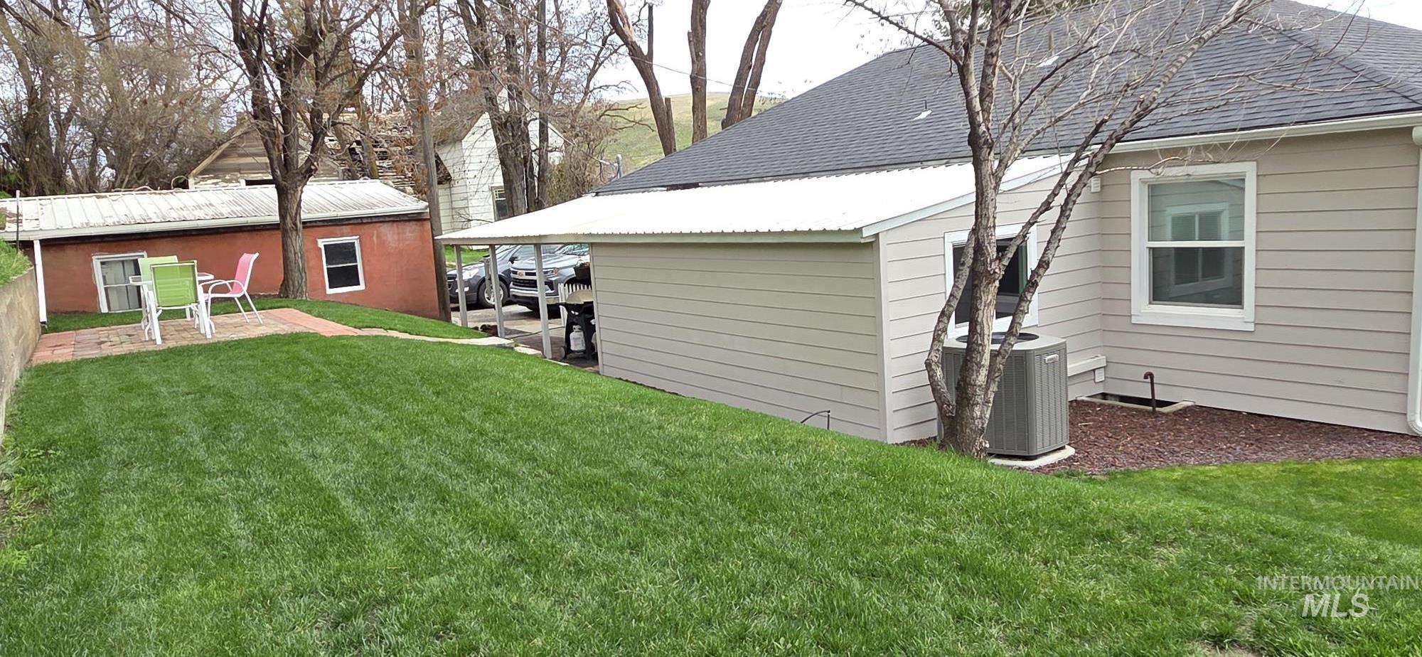1269 Main Street Pomeroy, WA 99347 - Photo 7 of 38 View of green lawn featuring a patio