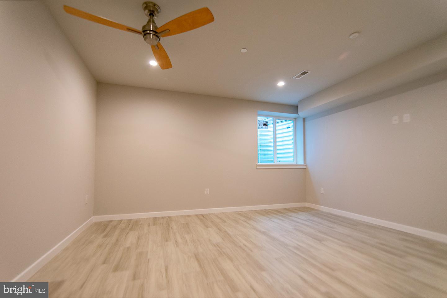 1713 South 20th Street, Unit 1 Philadelphia, PA 19145 - Photo 11 of 15 Spacious room with natural light and modern fan.
