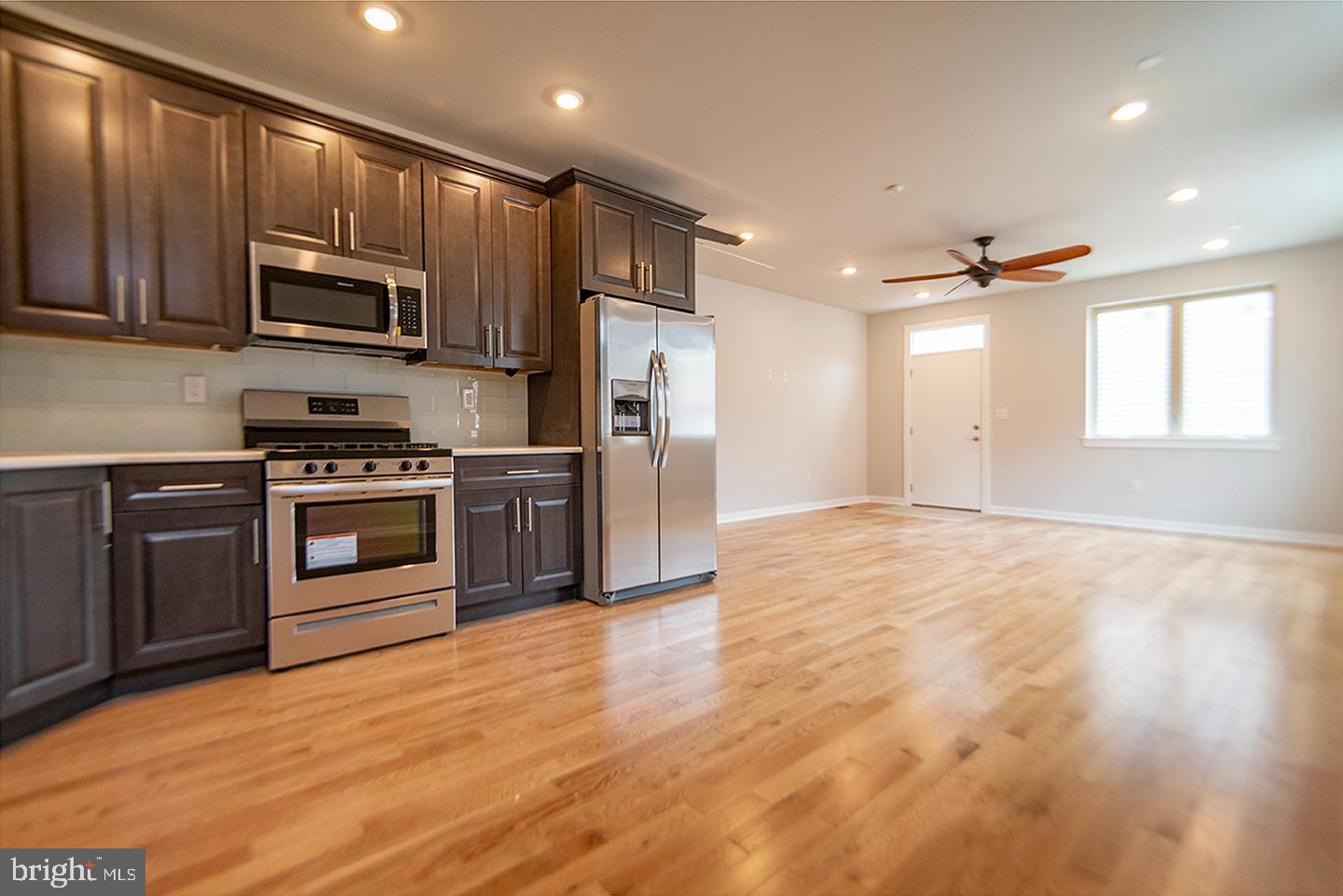 1713 South 20th Street, Unit 1 Philadelphia, PA 19145 - Photo 3 of 15 Modern kitchen with open living space.