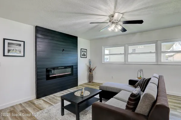a kitchen with stainless steel appliances granite countertop a stove top oven a sink a counter space and cabinets
