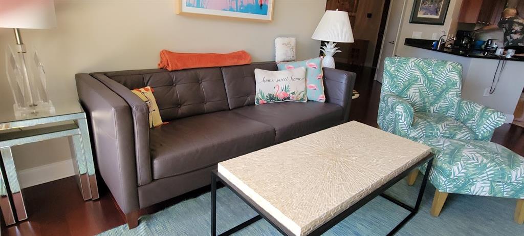 2509 North Ocean Boulevard, Unit 576 Fort Lauderdale, FL 33305 - Photo 11 of 22 a wooden floor with a table and chairs in it