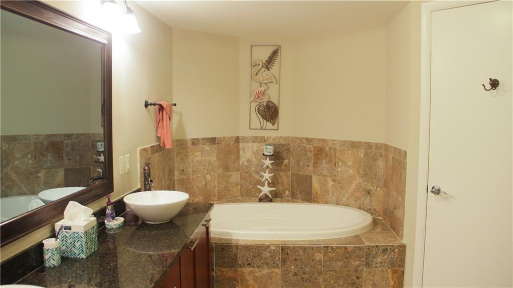 2509 North Ocean Boulevard, Unit 576 Fort Lauderdale, FL 33305 - Photo 14 of 22 a bathroom with a sink a toilet and a mirror